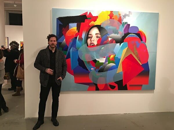 Erik Jones with artwork at opening night 