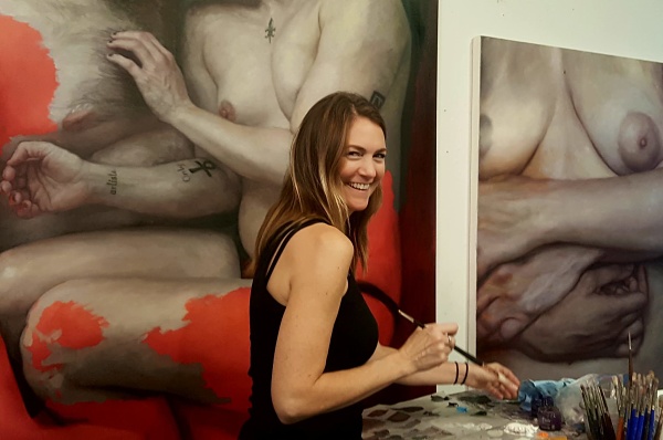 Michelle Lynn Doll painting in her studio 