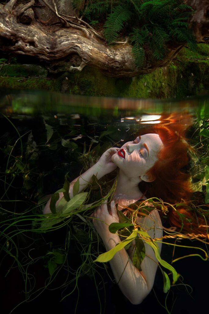 Beth Mitchell underwater red haired woman