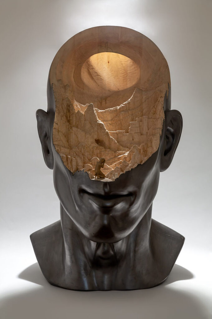 Richard Stipl carved wooden city in head