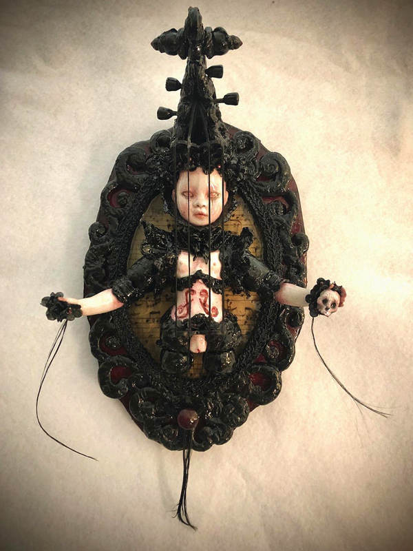 Stefanie Vega black doll sculpture