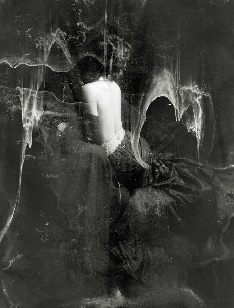 Abstract black and white image of a woman with her back turned on the camera by Jeremy Mann